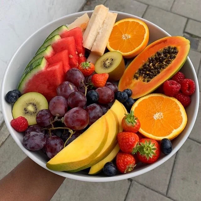 Colorful assortment of fresh fruits including apples, bananas, and berries.