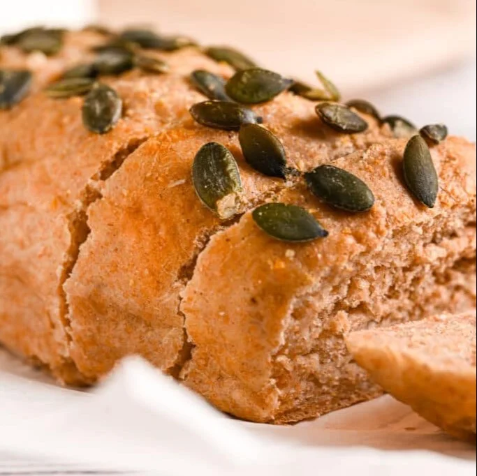 Freshly baked yogurt bread loaf on a wooden table