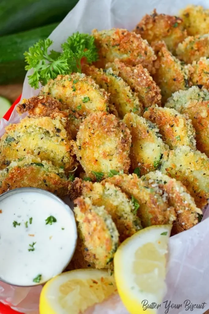 Bowl of Zucchini Parmesan Crisps served with dipping sauce
