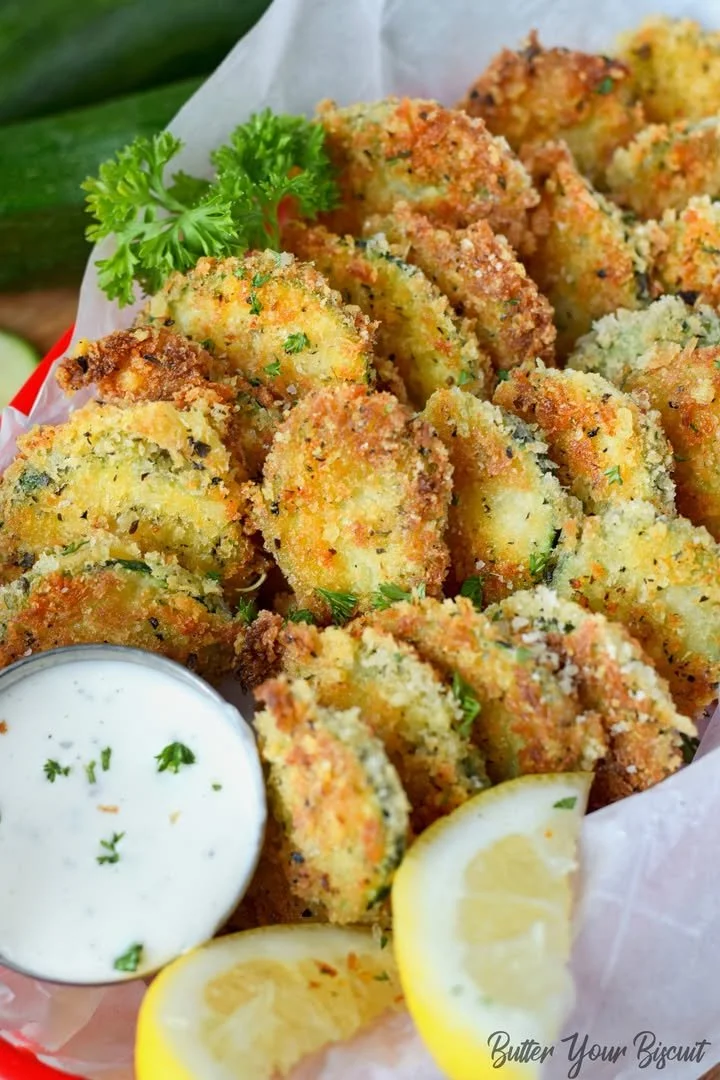 Bowl of Zucchini Parmesan Crisps served with dipping sauce