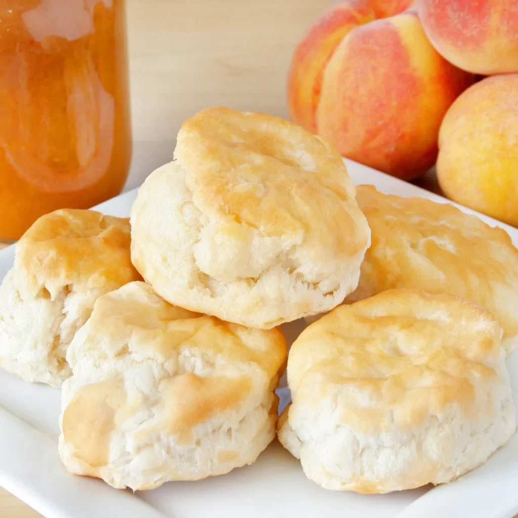 Three-ingredient biscuits fresh out of the oven, fluffy and golden brown.