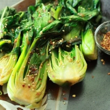 Delicious Baby Bok Choy cooked with Ginger and Garlic in a vibrant dish