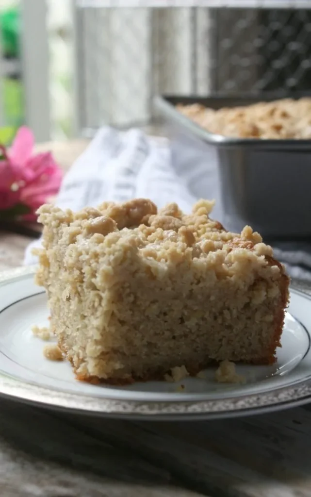 Delicious slice of Banana Bread Coffee Cake topped with a crumbly streusel.