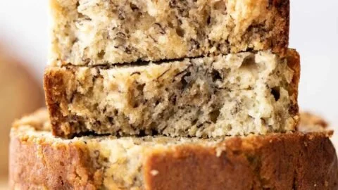 Freshly baked banana bread on a wooden cutting board
