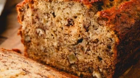 Deliciously baked banana bread served on a wooden board.