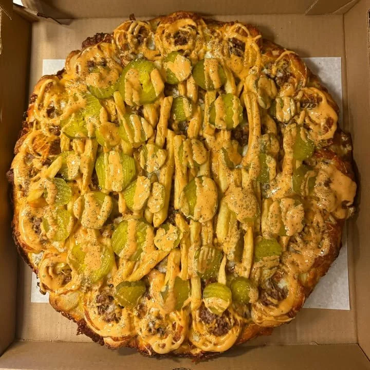 Big Mac Round Sicilian Pizza topped with burger ingredients and cheese