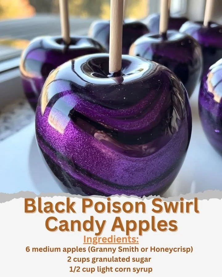 Black Poison Swirl Candy Apples with dark candy coating on wooden sticks