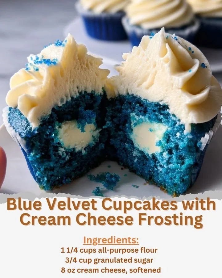 Blue velvet cupcakes with cream cheese frosting on a decorative platter