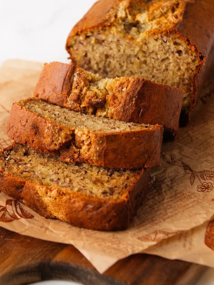 Delicious slice of brown butter banana bread with nuts and a golden crust