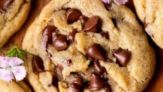 Freshly baked brown butter chocolate chip cookies on a cooling rack