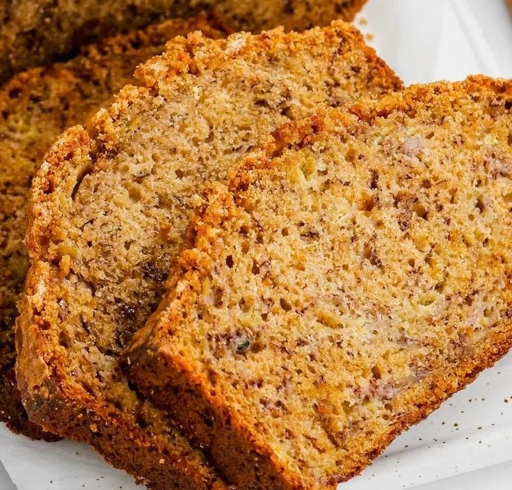 Delicious slice of brown sugar banana bread on a wooden table