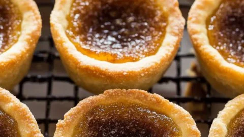 Delicious homemade butter tarts with a gooey filling and flaky crust