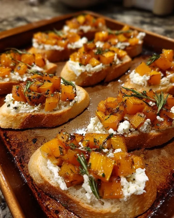 Butternut squash crostini topped with goat cheese and rosemary honey