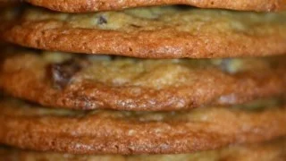 Freshly baked chocolate chip cookies on a cooling rack