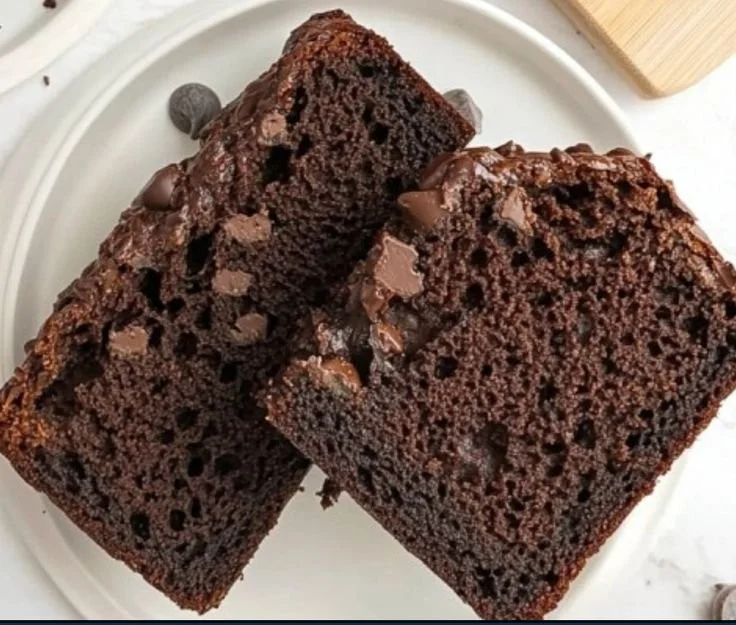 Delicious homemade chocolate zucchini bread on a wooden cutting board