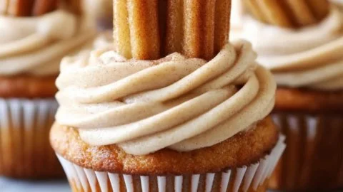 Delicious churro cupcakes with cinnamon sugar topping and creamy frosting
