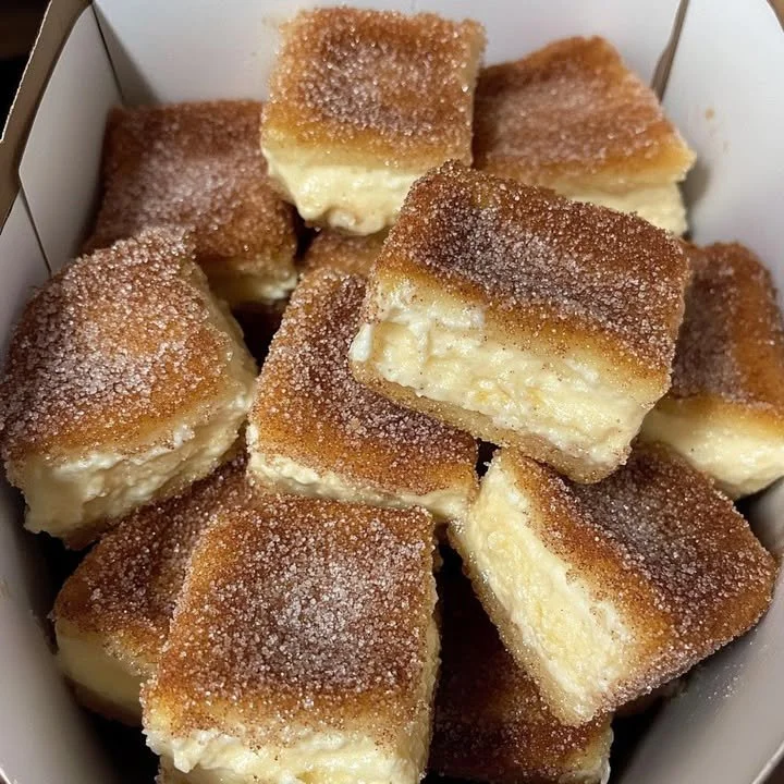 Delicious churro stuffed cheesecake bites with a golden, crispy coating
