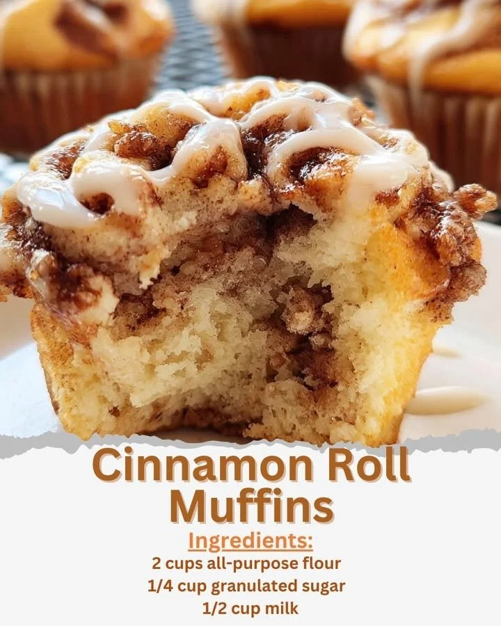 Delicious cinnamon roll muffins topped with icing on a white plate.