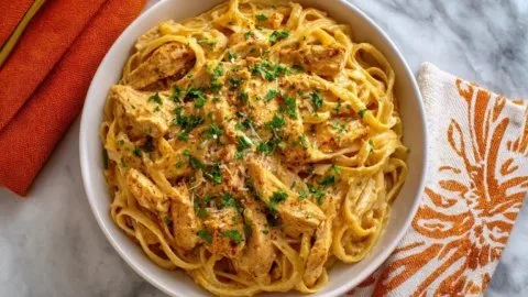 Cowboy Butter Chicken Linguine garnished with herbs and spices.