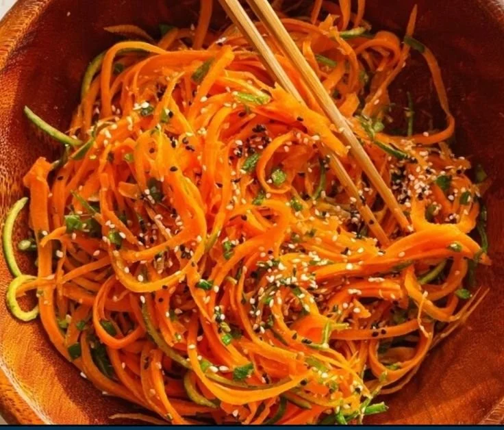 Fresh Cucumber Carrot Salad in a bowl with vibrant colors and healthy ingredients.