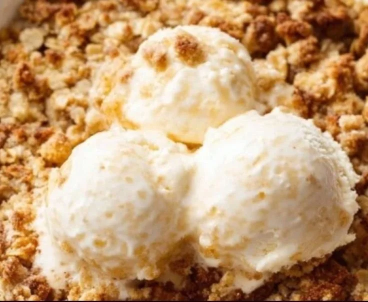Delicious homemade easy apple crumble served in a bowl with ice cream