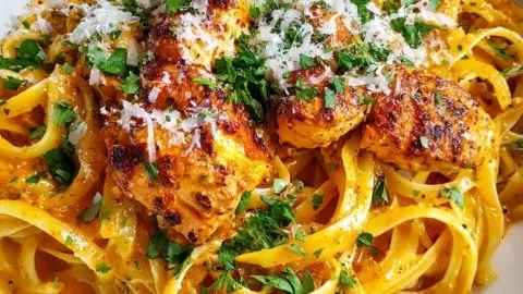 Delicious Cowboy Butter Chicken Linguine topped with fresh herbs and spices.
