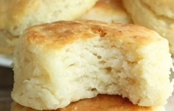 Freshly baked easy homemade biscuits on a wooden table