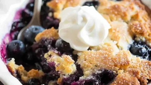 Freshly baked easy homemade blueberry cobbler served in a dish
