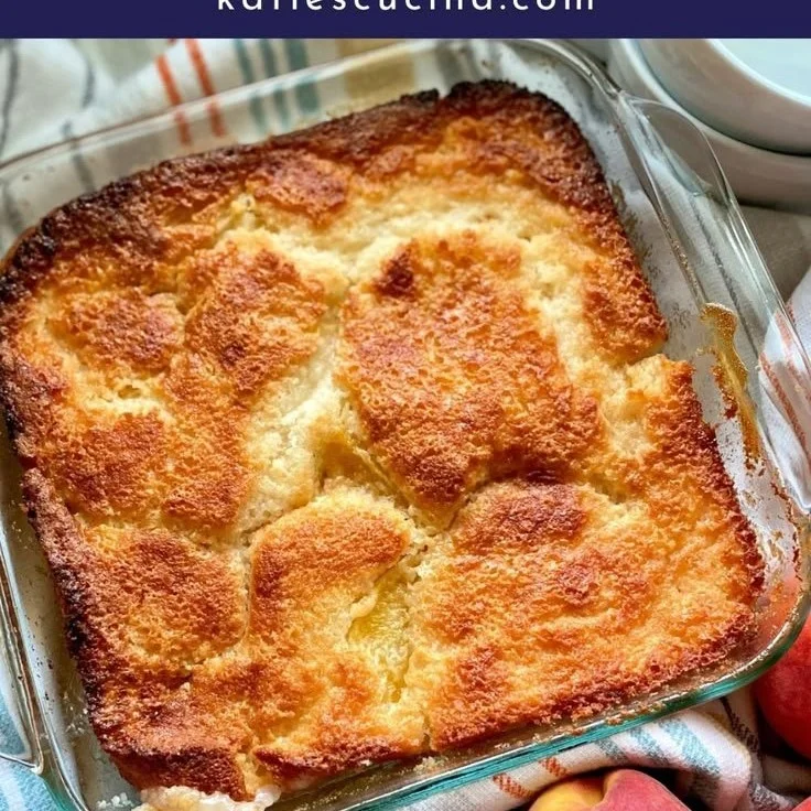 Slice of old fashioned peach cobbler served with vanilla ice cream
