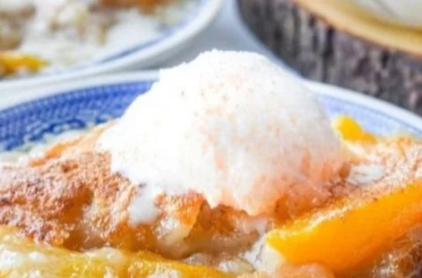 Delicious easy peach cobbler served warm with ice cream