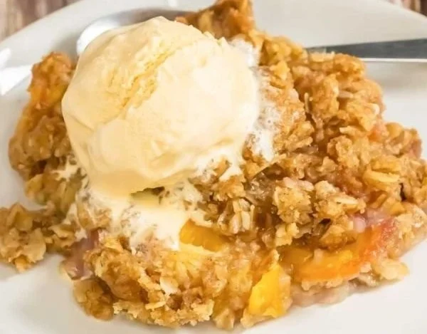 Easy peach crisp dessert with juicy peaches and crunchy topping