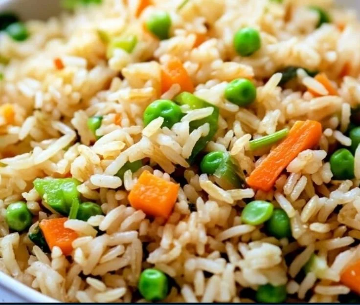 Delicious easy vegetable fried rice with colorful veggies and steaming grains