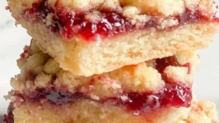 Five-ingredient raspberry bars on a plate ready to serve for dessert.