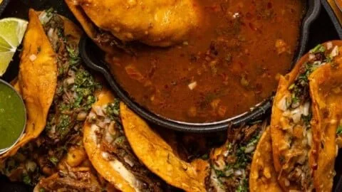 Deliciously prepared Birria Tacos with tender meat and flavorful broth