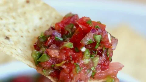 Delicious bowl of fresh zesty homemade salsa with vibrant ingredients