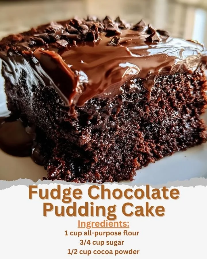 Decadent fudge chocolate pudding cake topped with chocolate curls and berries.