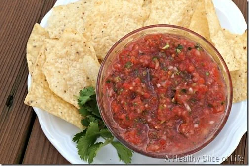 A vibrant bowl of homemade Garden Salsa with fresh vegetables and herbs