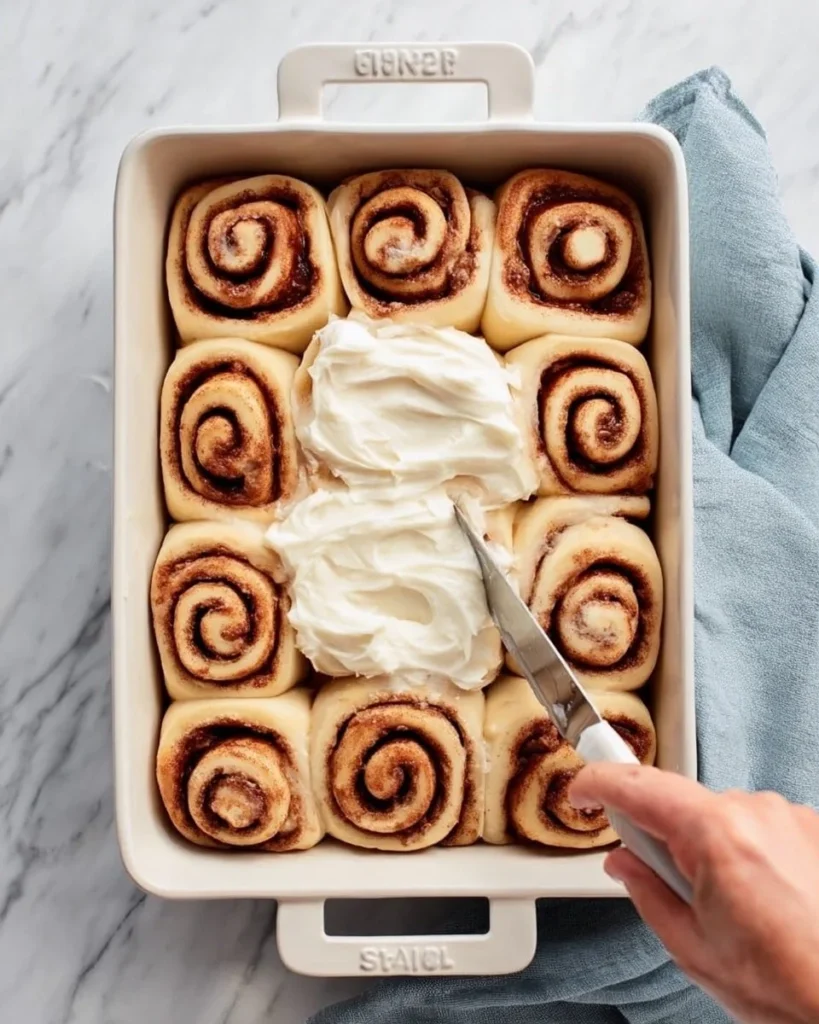 Decadent gooey cinnamon rolls topped with creamy frosting