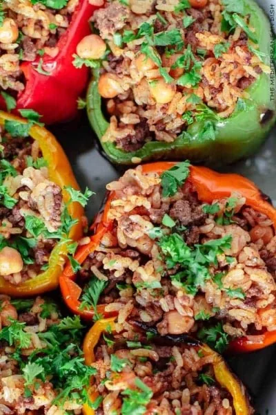 Greek Style Stuffed Peppers filled with herbs, rice, and feta cheese.
