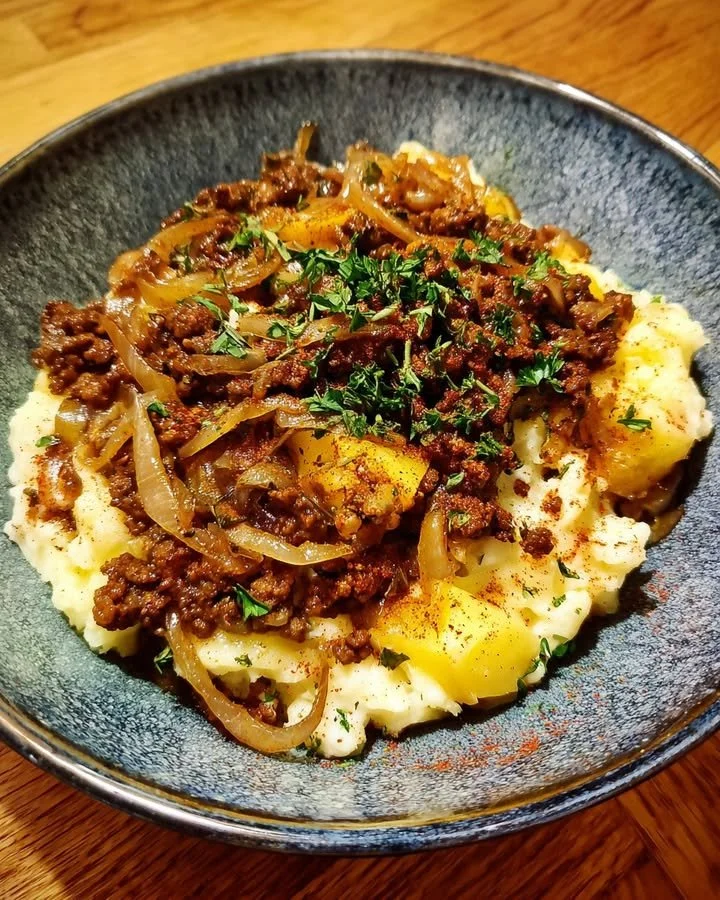 Home-Style Beef & Onion Skillet with Creamy Potatoes served in a skillet