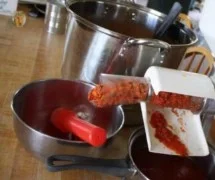 A bowl of homemade spaghetti sauce with fresh ingredients and herbs