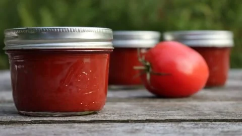 Homemade tomato paste cooked from fresh tomatoes for delicious recipes.