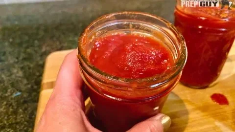 Homemade tomato paste made from fresh tomatoes for cooking and sauces.