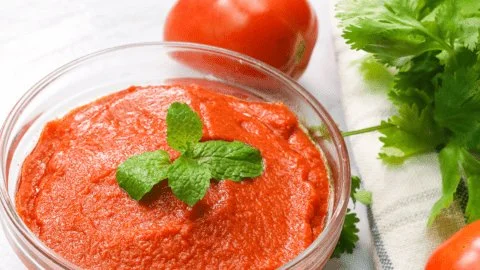 Homemade tomato paste made from fresh tomatoes for rich flavor