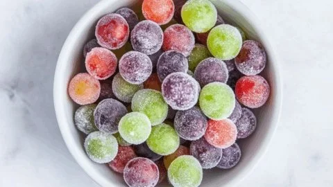 Delicious Kool-Aid grapes in a bowl, a colorful and fun snack.