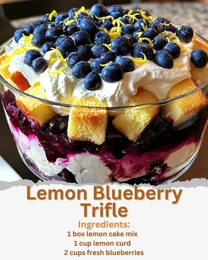 Delicious lemon blueberry trifle dessert with layers of cream and berries