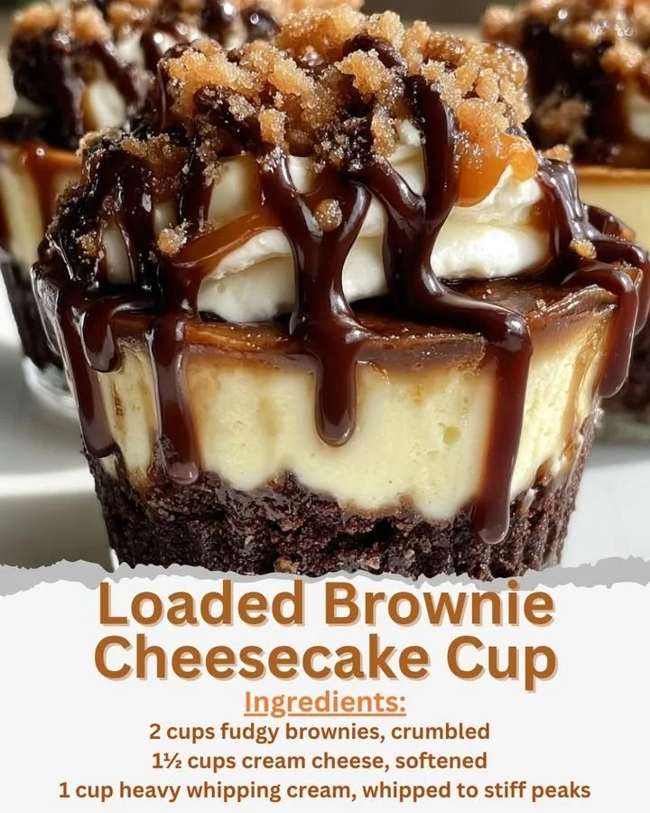 Loaded Brownie Cheesecake Cup topped with chocolate drizzle and whipped cream