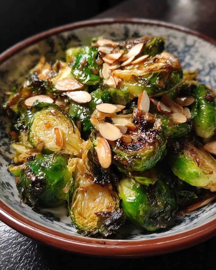 Maple and garlic roasted Brussels sprouts garnished with almonds