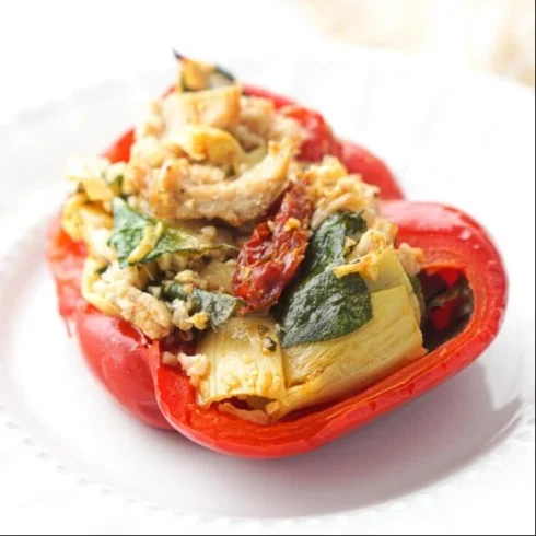 Mediterranean Chicken Stuffed Bell Peppers beautifully arranged on a plate.