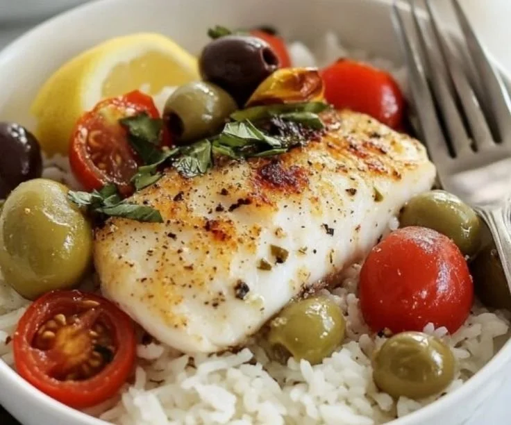 Delicious Mediterranean Fish Bake with vibrant vegetables and herbs.